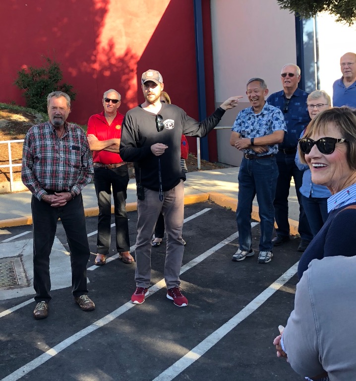 Where is South? asked  Kent Madin, puzzled by the direction of the solar panels in the parking lot.  Our guide Asst. Princ. Jon Drury points the way, to the amusement of  Charlie Tarpley, Dave Long, Larry Tom, et al, Ayn Sanborn Loomis.  BTW-the array fac